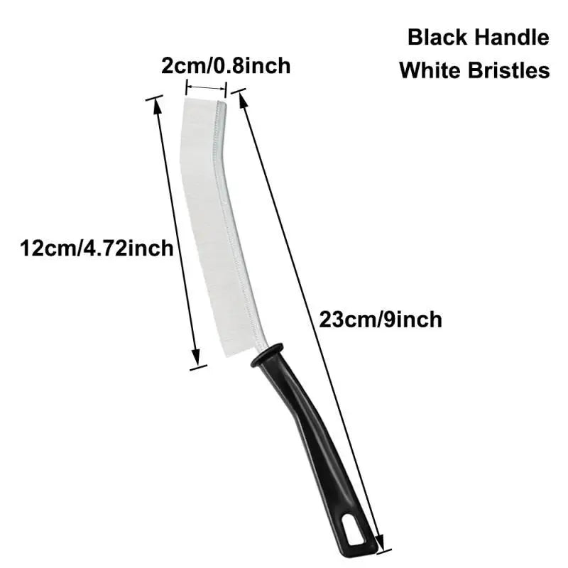 A white crevice cleaning brush with a black handle and white bristles shown in a side view.