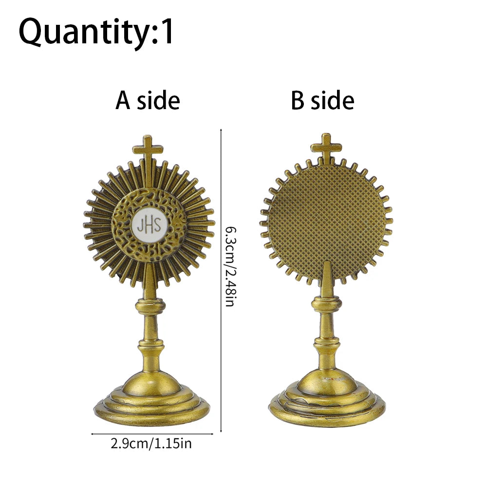 A side and B side views of a gold-colored metal religious ornament with a cross and sunburst design.