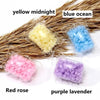 Assortment of laundry fragrance beads in yellow midnight, blue ocean, red rose, and purple lavender packaged in clear plastic