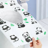 A hand holds a white disposable printing seat cover featuring black panda designs on a light blue surface.