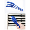 A blue reusable household cleaning brush with a handle is shown being used to clean grooves or crevices.