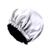 A silver satin sleep cap with ruffled edges is shown against a white background.