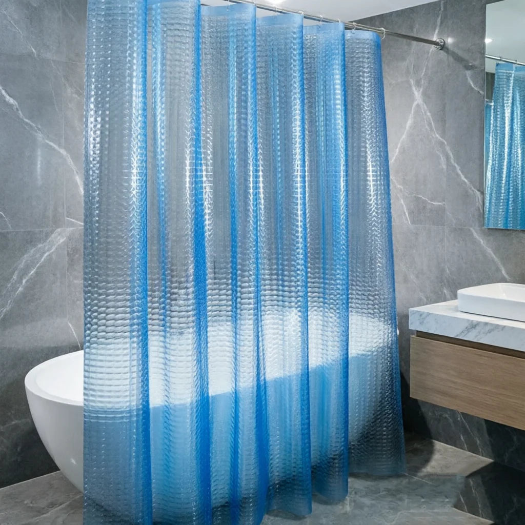 A set of clear blue 3D crystal texture waterproof shower curtain liners hanging in a bathroom.