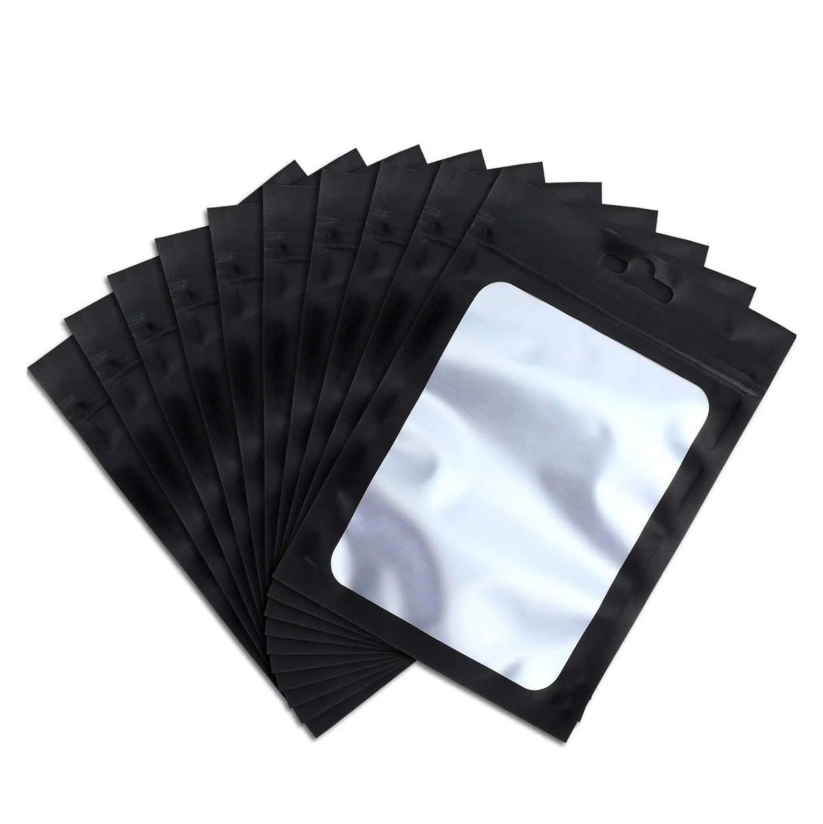 A stack of black velvet jewelry display pouches, with one pouch open to reveal a white insert.