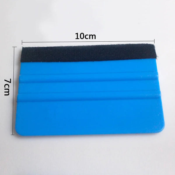A blue squeegee with a black felt pad used for vinyl wrap and film installation.