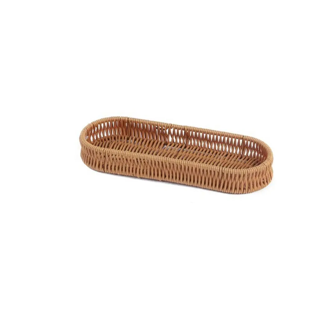 A rectangular serving basket handwoven from natural brown rattan.