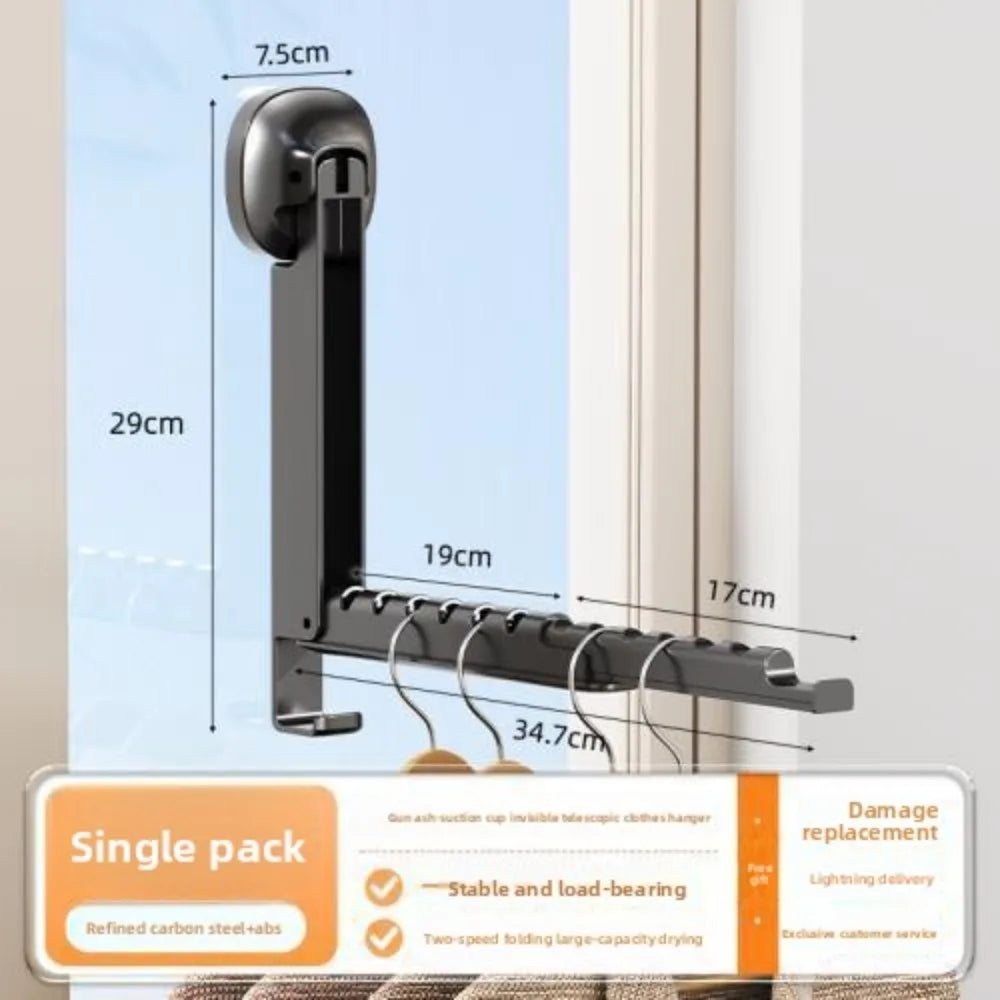 A black foldable wall drying rack with suction cups shown mounted on a window frame.