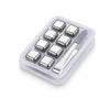 A clear plastic container holding multiple reusable stainless steel whiskey ice cubes and a small knife.