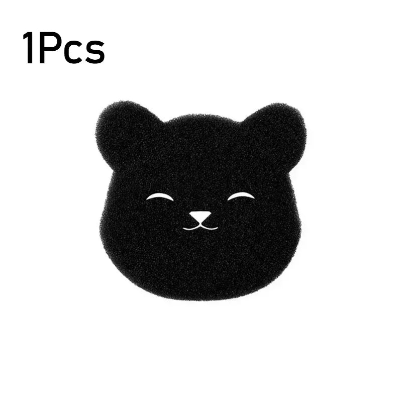 A small, black, fuzzy cat-shaped pet hair remover sponge.
