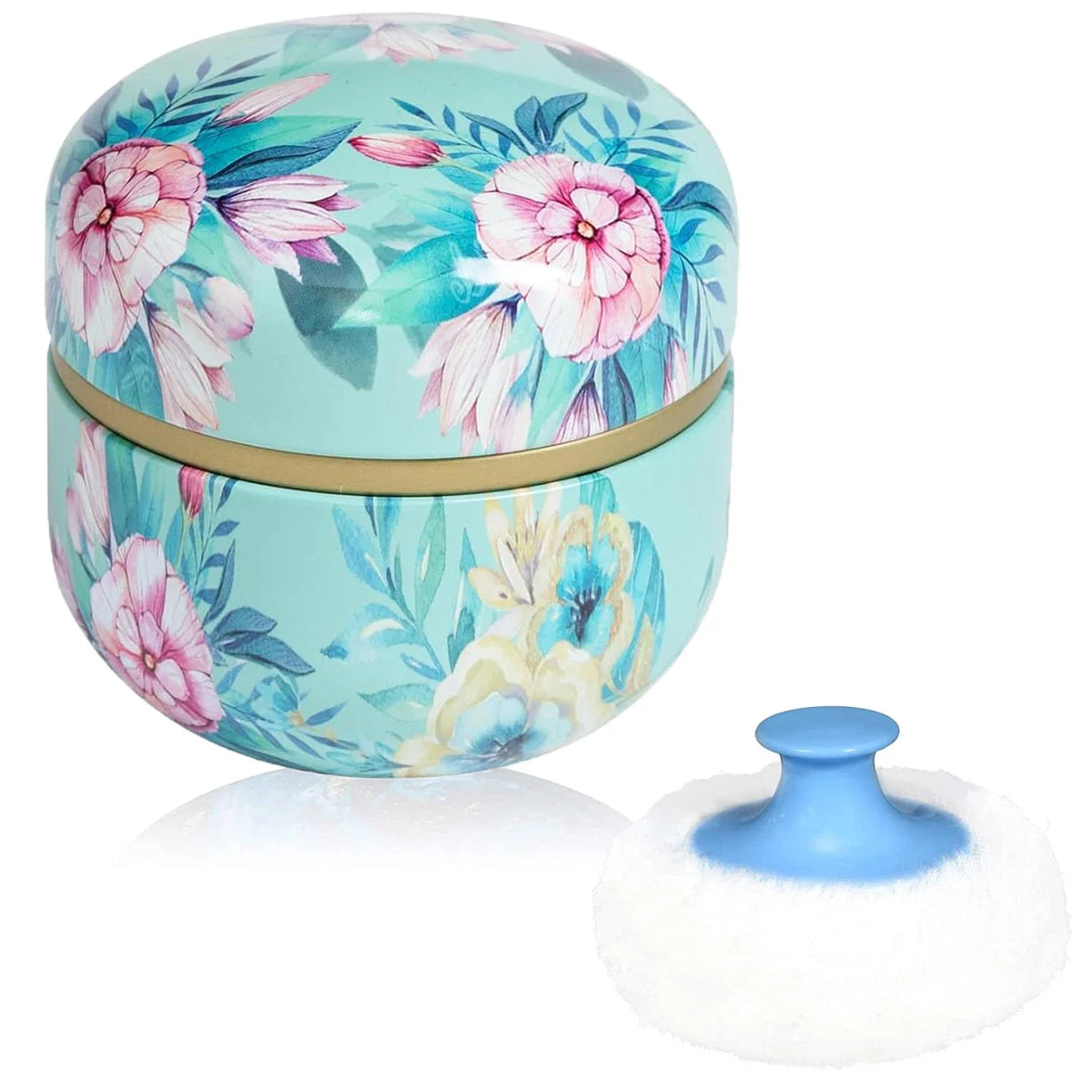 Runde Kosmettkoffer mit Deckel und rosa-türkisenen Blumenmustern neben einer weißen Kosmetikschwamm