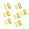 A collection of small gold bar decorative ornaments scattered across a white background.