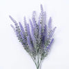 A sprig of artificial lavender flowers with purple-blue spikes.