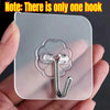 A clear silicone hook is shown attached to a square glass cleaning tool.