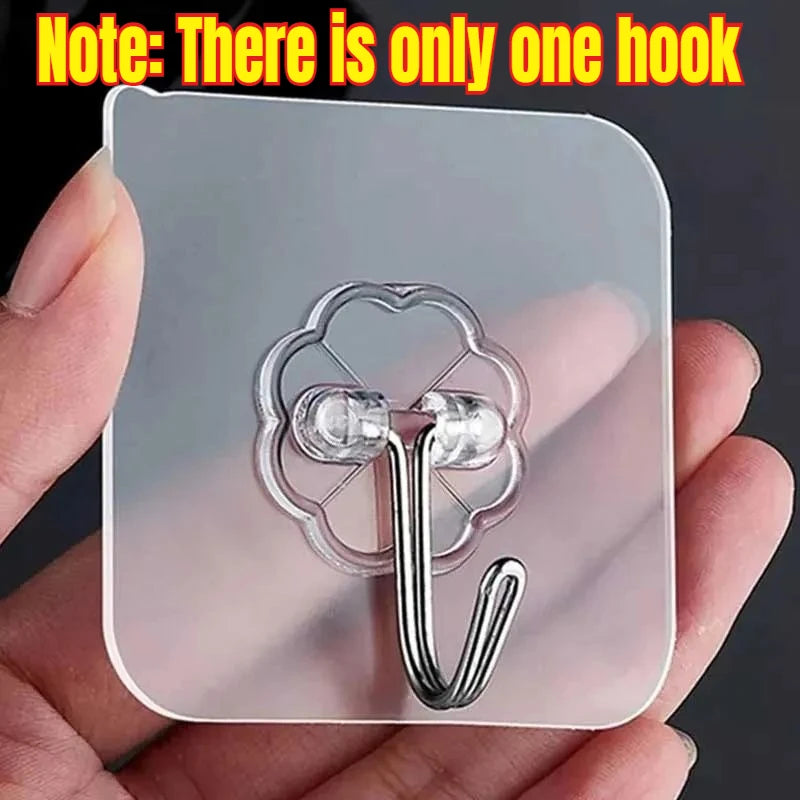 A clear silicone hook is shown attached to a square glass cleaning tool.