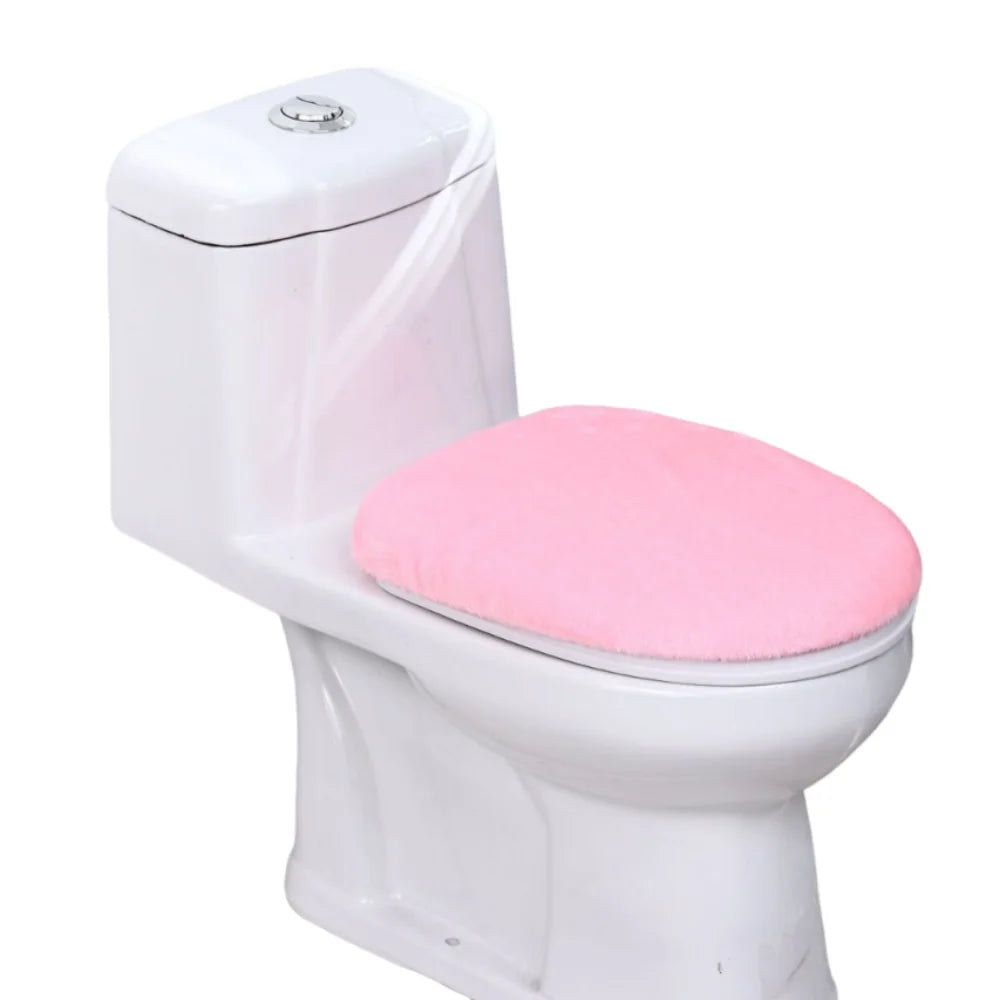 A white toilet with a pink protective seat cover installed.