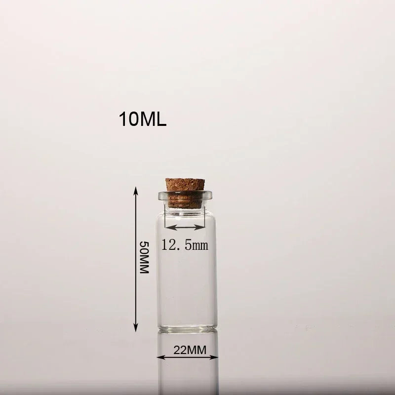 A clear glass bottle with a cork, labeled 10ML, shown next to a measuring scale.