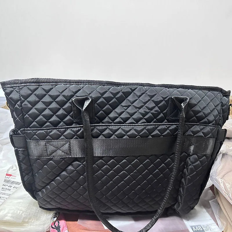 Black quilted multi-pocket tote bag for laptop and daily organizer