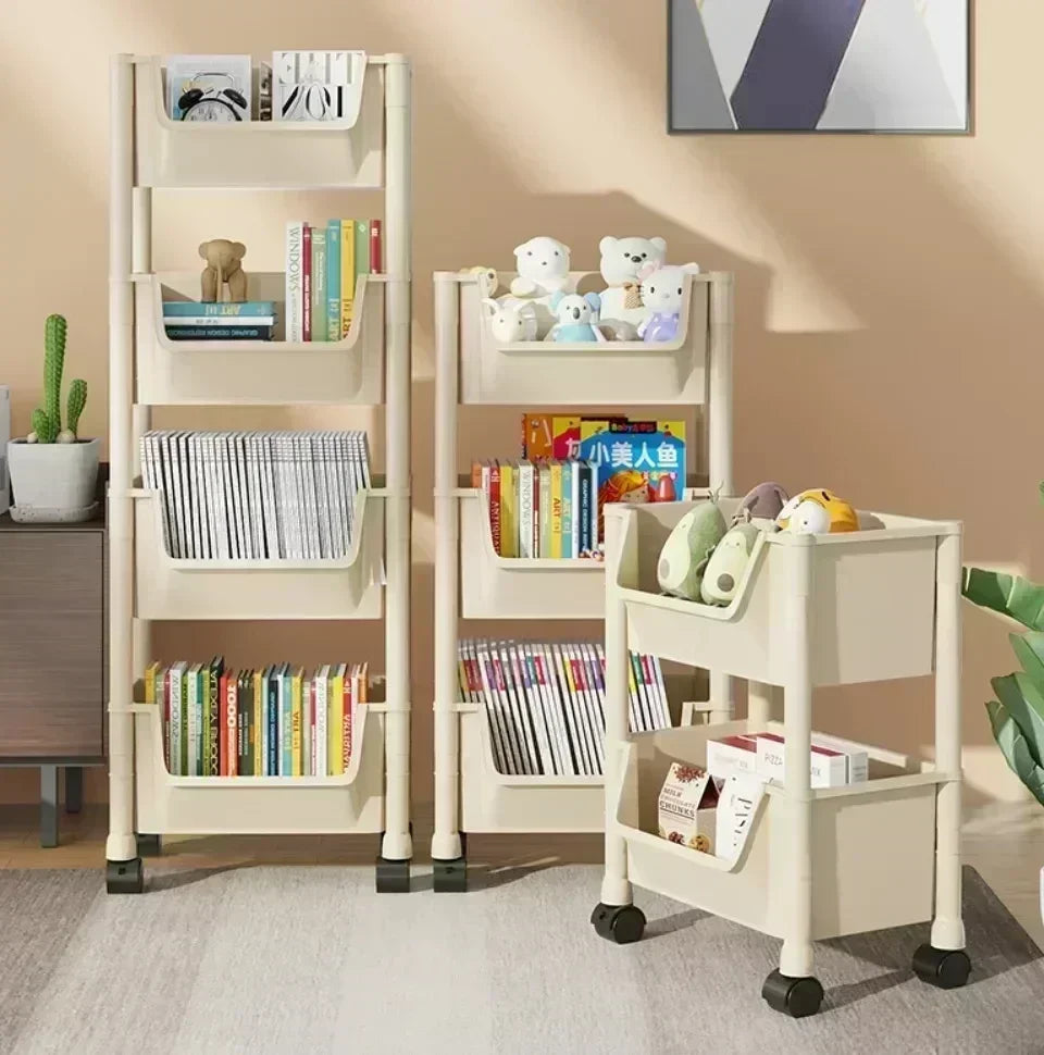 A light wood multi-tier rolling storage rack filled with books and stuffed animals in a bright room.