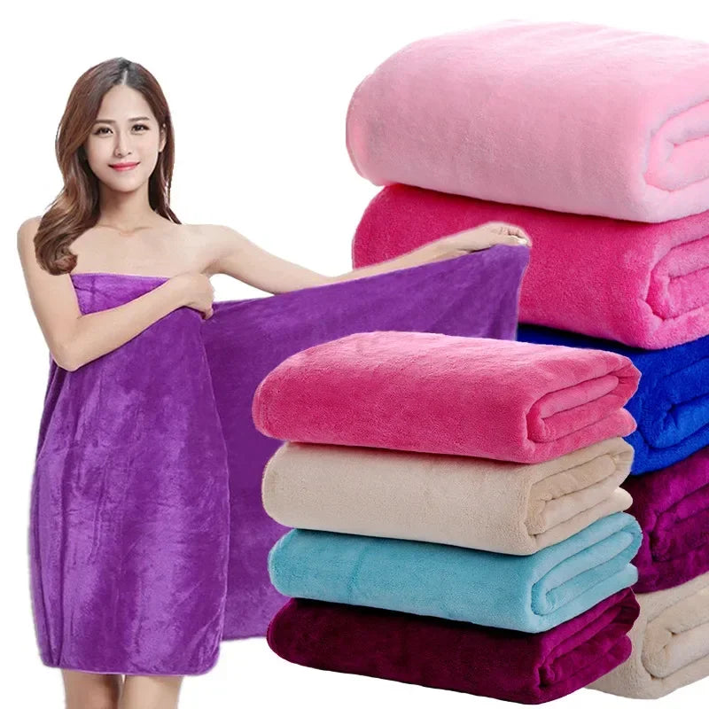 A stack of various colored ultra-absorbent microfiber bath towels, including pink, purple, red, and blue.