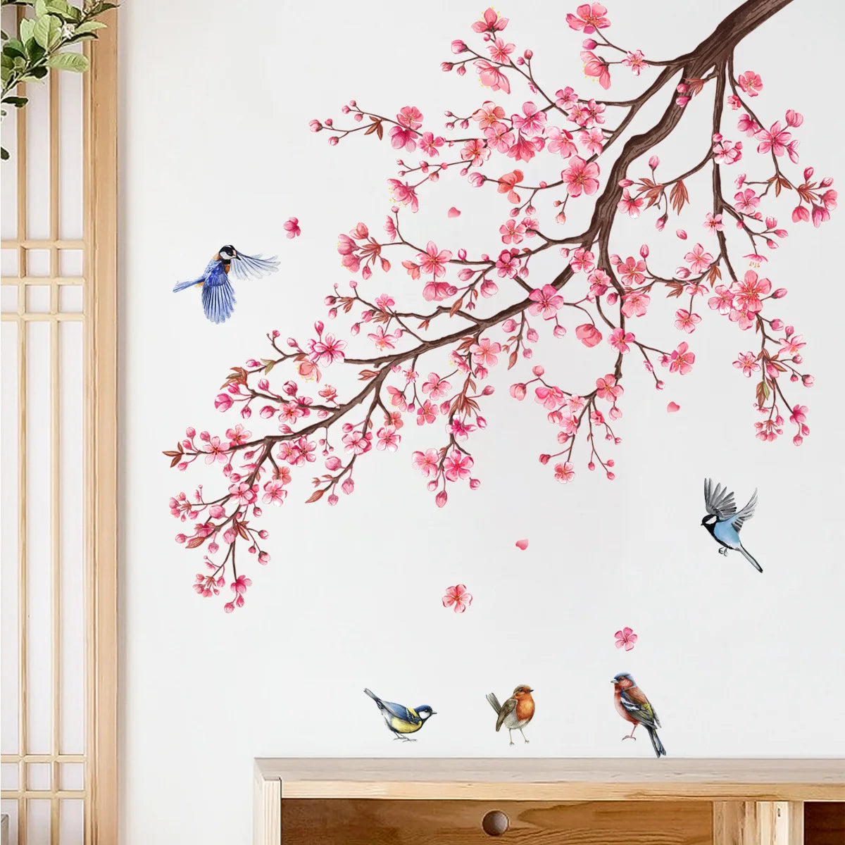 A watercolor painting of pink blossoms on dark branches against a white background.