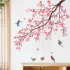 A watercolor painting of pink blossoms on dark branches against a white background.