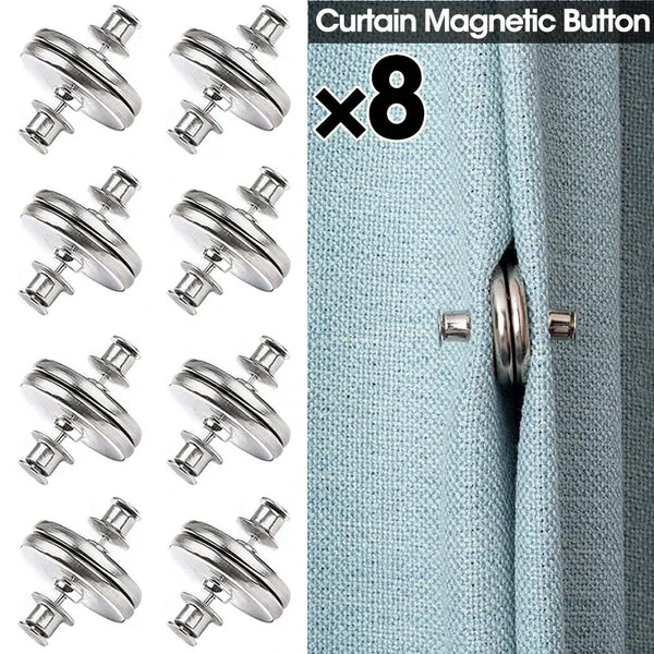 Eight silver magnetic curtain buttons used to fasten a light blue fabric.