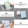 A laundry hamper with a wide-opening top, a small pocket for towels and socks, and a bottom zipper design.