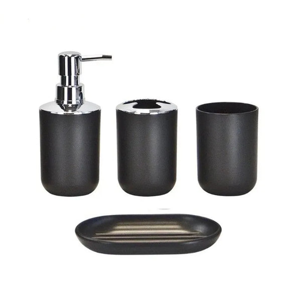 A set of four black bathroom organizers including a pump dispenser and soap dishes.