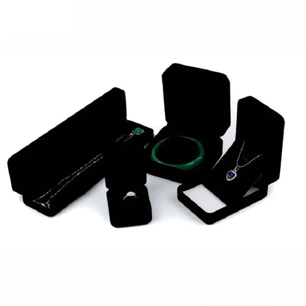 Elegant black velvet jewelry storage box set with a lid and a necklace display slot