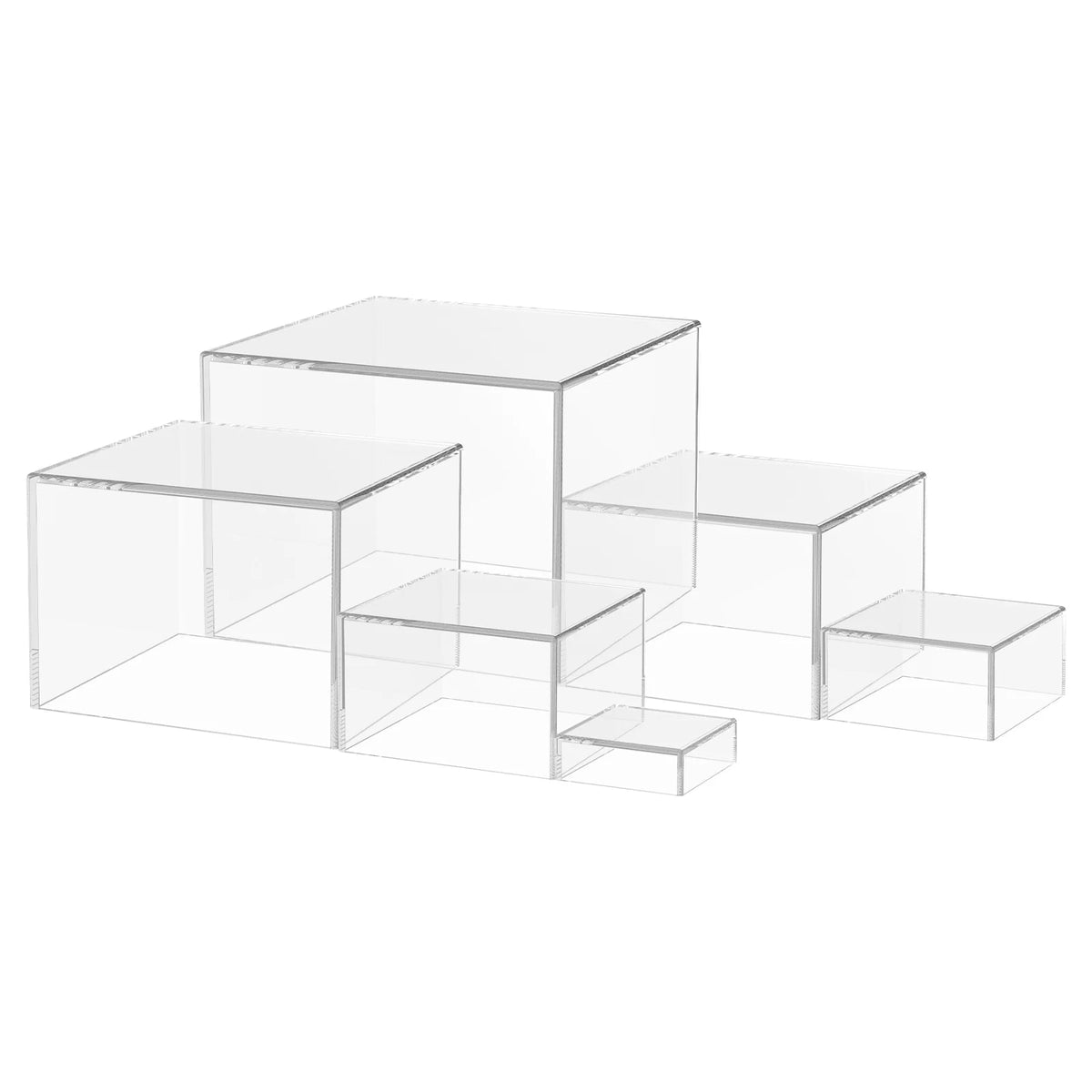 A stack of clear acrylic rectangular risers used for food display.