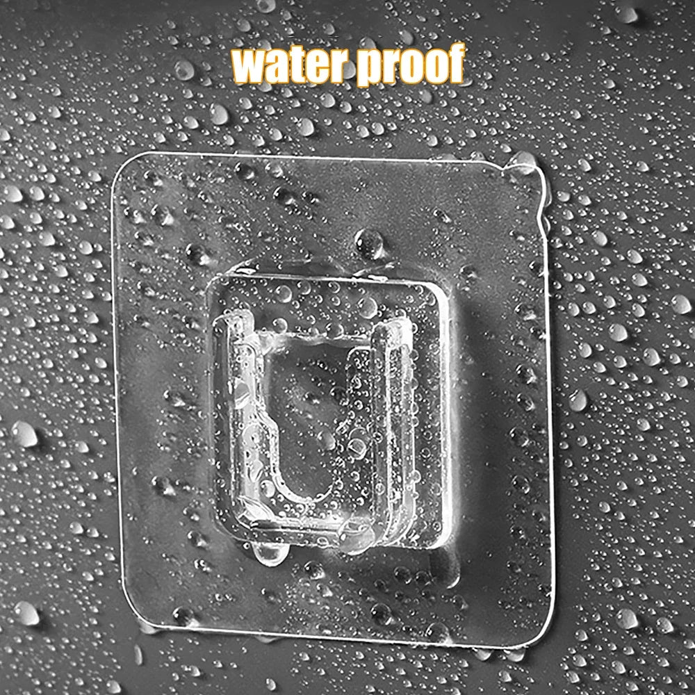 A clear, square adhesive wall hook is shown wet on a dark surface surrounded by water droplets.