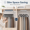 A woman is hanging clothes on velvet hangers in a closet room, demonstrating slim space saving.