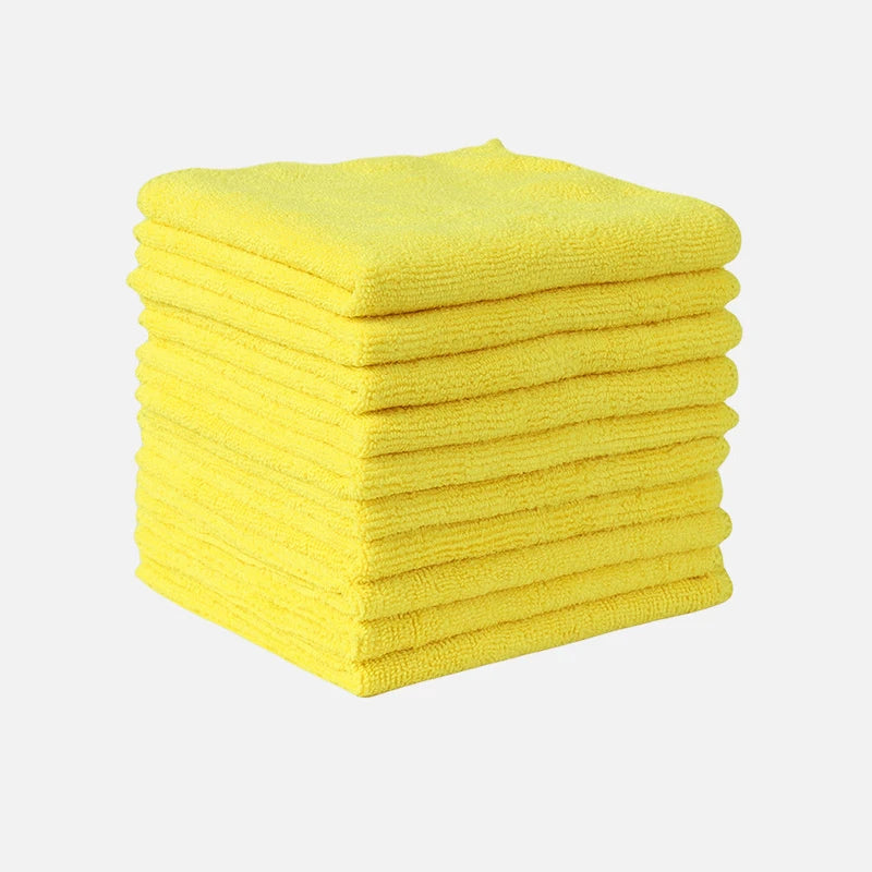 A stack of bright yellow thickened microfiber cleaning cloths.