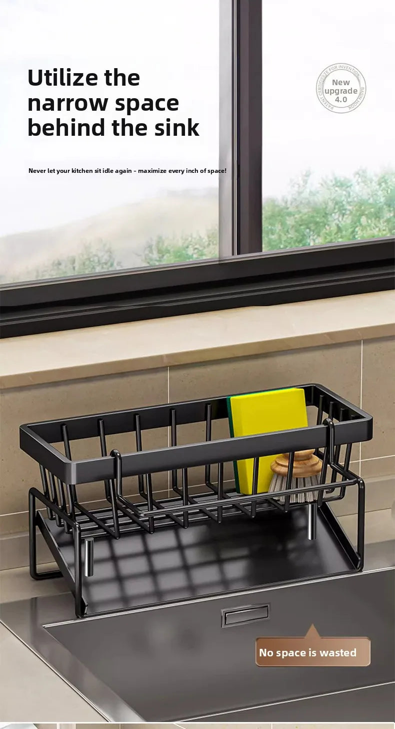 Black kitchen sponge holder and drain rack with a hanging hook placed inside a kitchen sink.