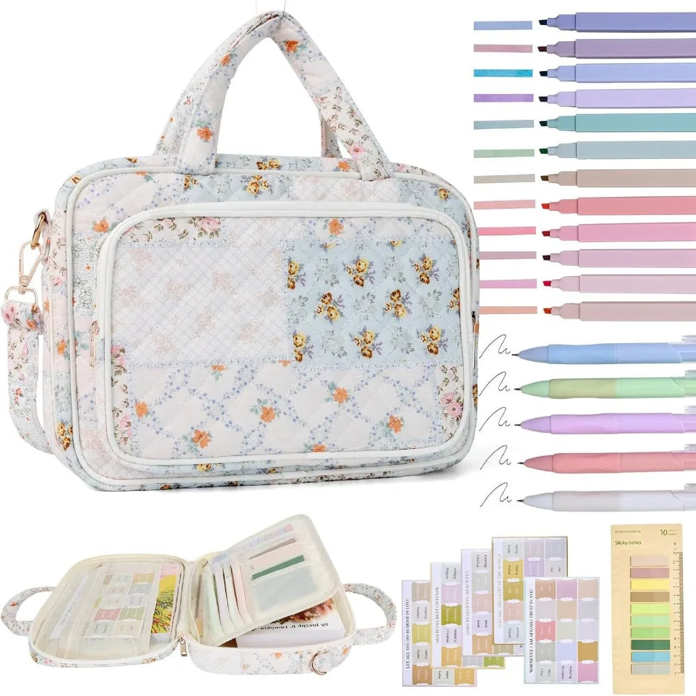 A white quilted floral bible cover with a handle and various study accessories like pens and rulers.