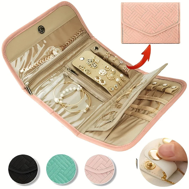 A pink foldable waterproof jewelry organizer bag open to show various jewelry and accessories.