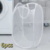 A set of six white foldable mesh laundry baskets or organizers displayed on a shelf.