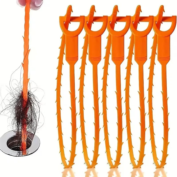 A set of orange multi-purpose drain and blockage removal tools, including a long rod and several curved hooks.