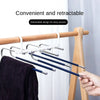 Stainless steel retractable hangers for clothes displayed on a wooden rack.