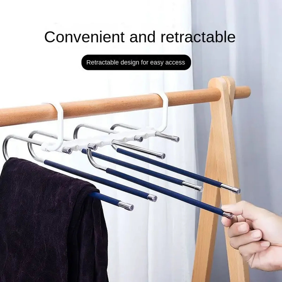Stainless steel retractable hangers for clothes displayed on a wooden rack.