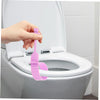 A hand is lifting a silicone toilet lid lifter from the inside of a white toilet bowl.