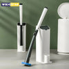 A long-handled disposable toilet brush with a black handle and blue bristles is shown next to a white dispenser.