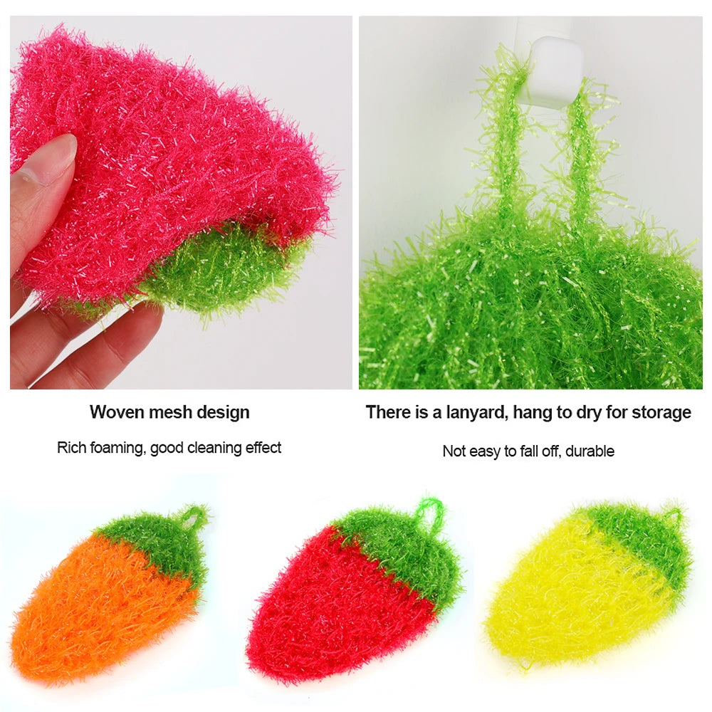 Three strawberry-shaped scouring sponges in red, green, and yellow fibers for kitchen cleaning