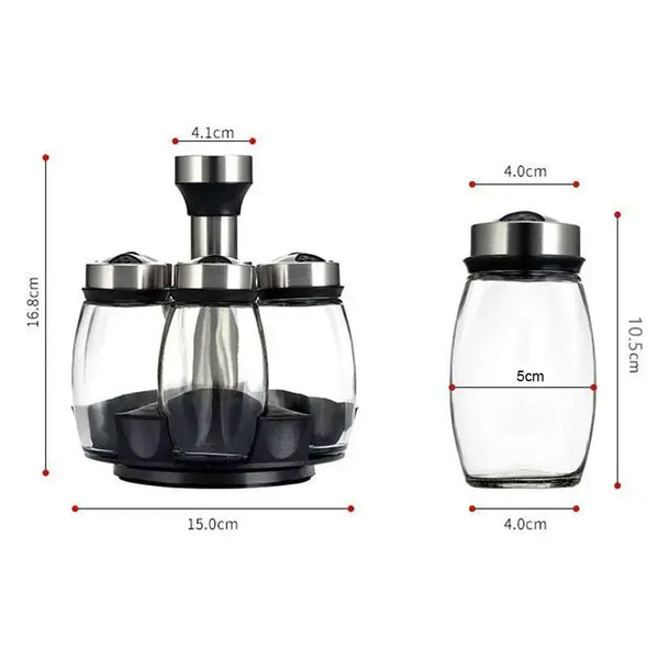 A rotating glass spice jar rack with stainless steel lids shown from the side.