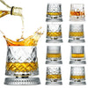 Un juego de dos vasos de whisky giratorios con cuencos de vidrio transparente y ámbar y bases de plata.