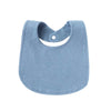 A light blue soft cotton baby bib with a rounded shape and a small loop for fastening.