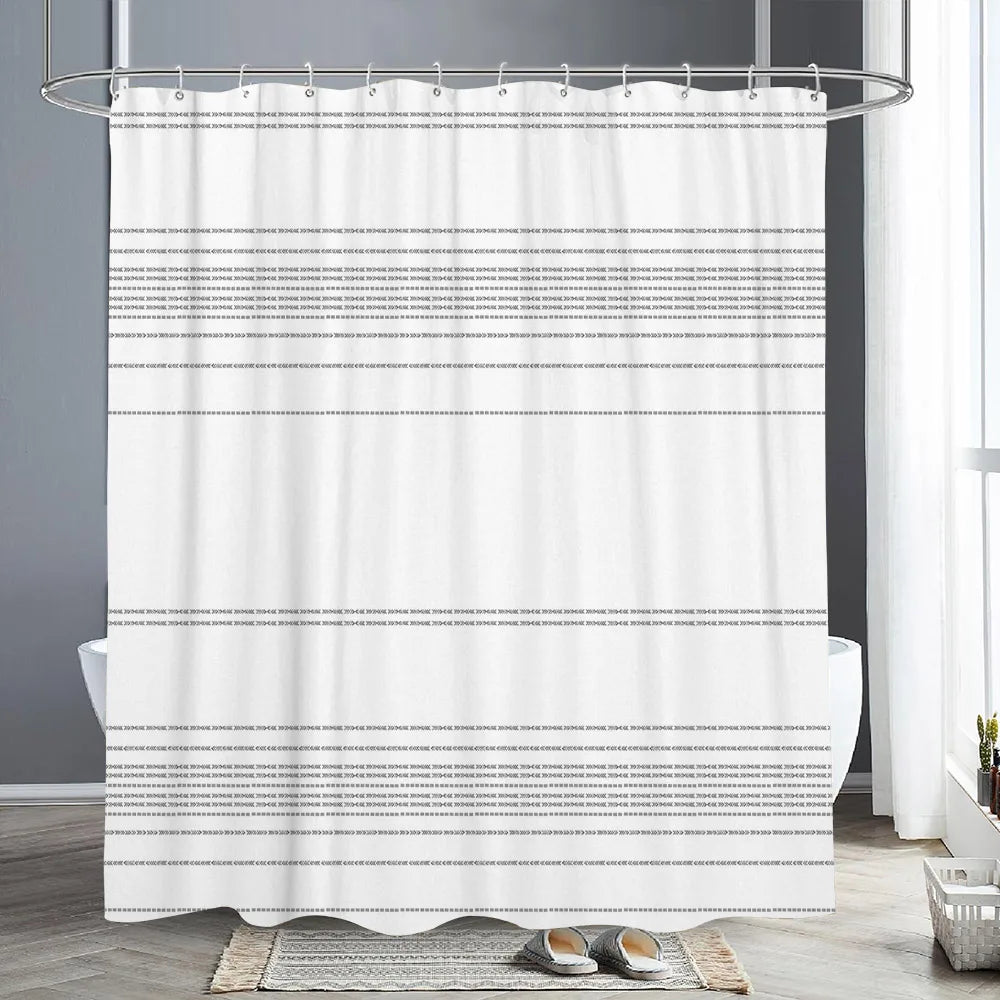 White abstract geometric line shower curtain hanging from a metal rod