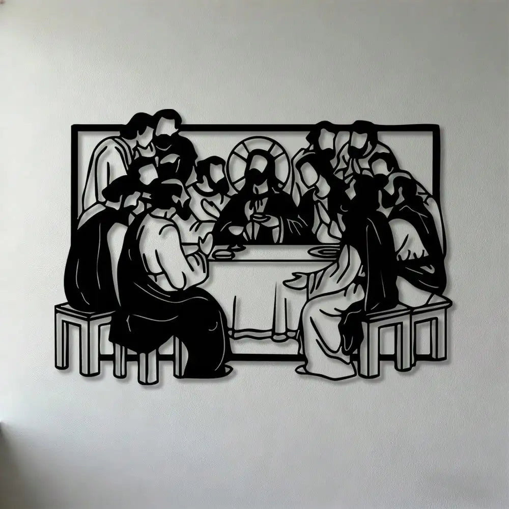Black silhouette wall art depicting a group of figures gathered around a table with a central cross.