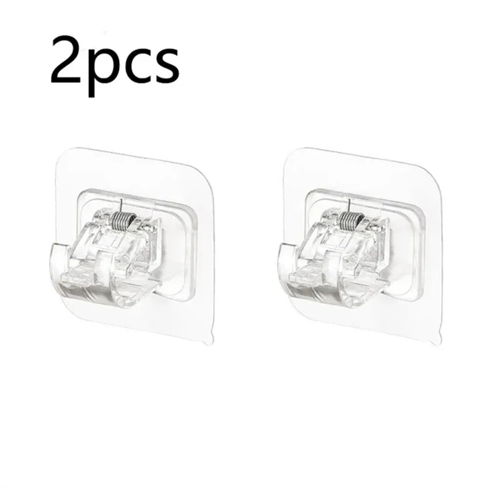 Two clear self-adhesive curtain rod hooks are shown for hanging curtains.
