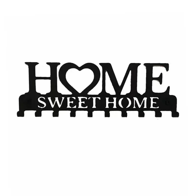 Black rustic metal wall hook key holder with the words HOME SWEET HOME carved into the design.